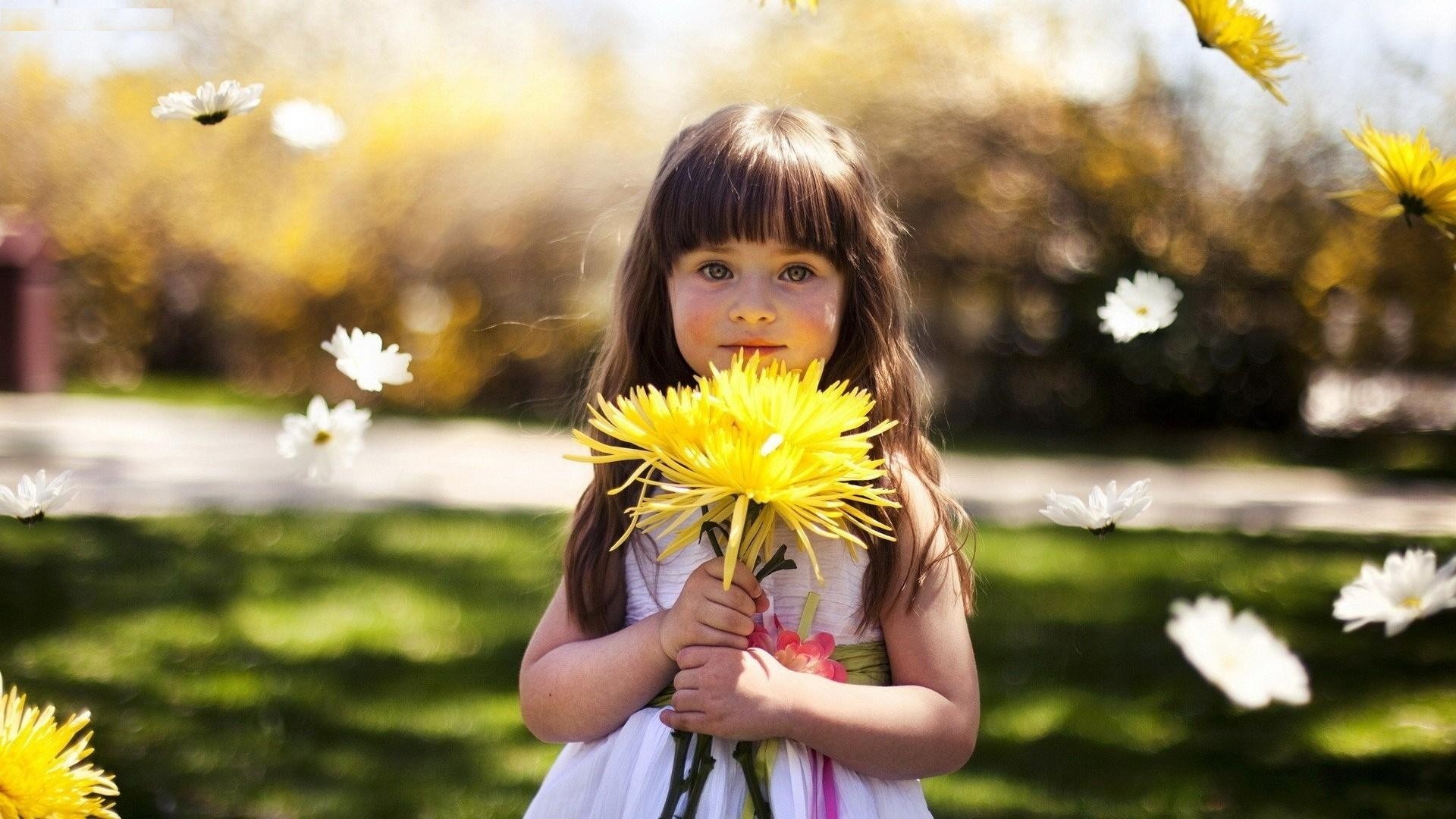 Lovely Beauty Baby Girl Having Yellow Sunflower
